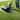 Person using a lawn edger on a grassy area