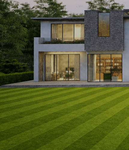 Modern house with large windows and a well-maintained lawn