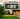 Modern house with a well-maintained garden and trees